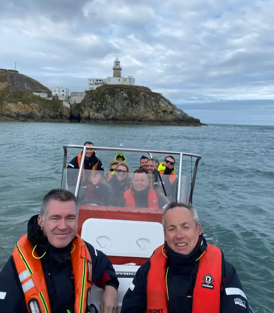 Group celebrating a birthday party with a festive boat tour on the river