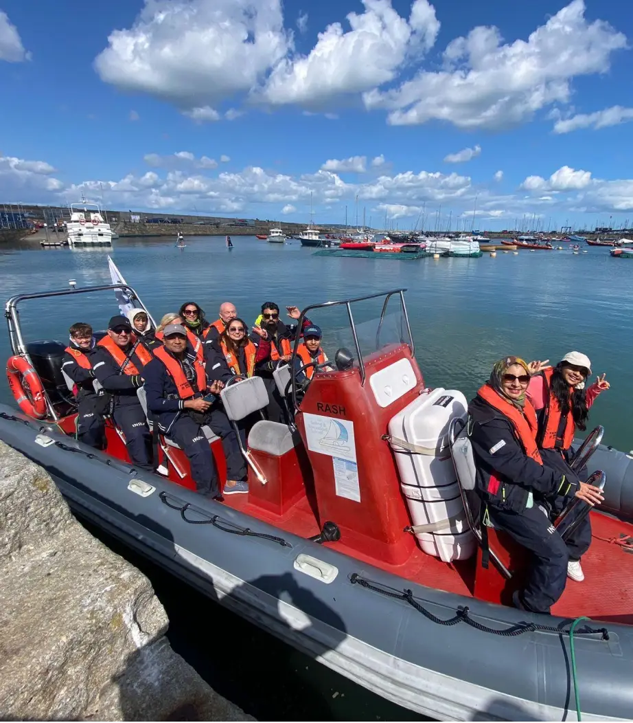 Corporate team enjoying a relaxing boat tour as part of a group outing or company event