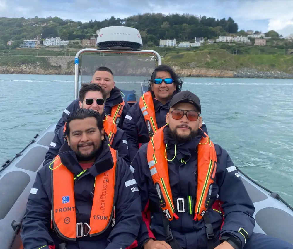 Colleagues enjoying a corporate boat tour on Dublin’s River Liffey, networking in a relaxed and scenic setting.